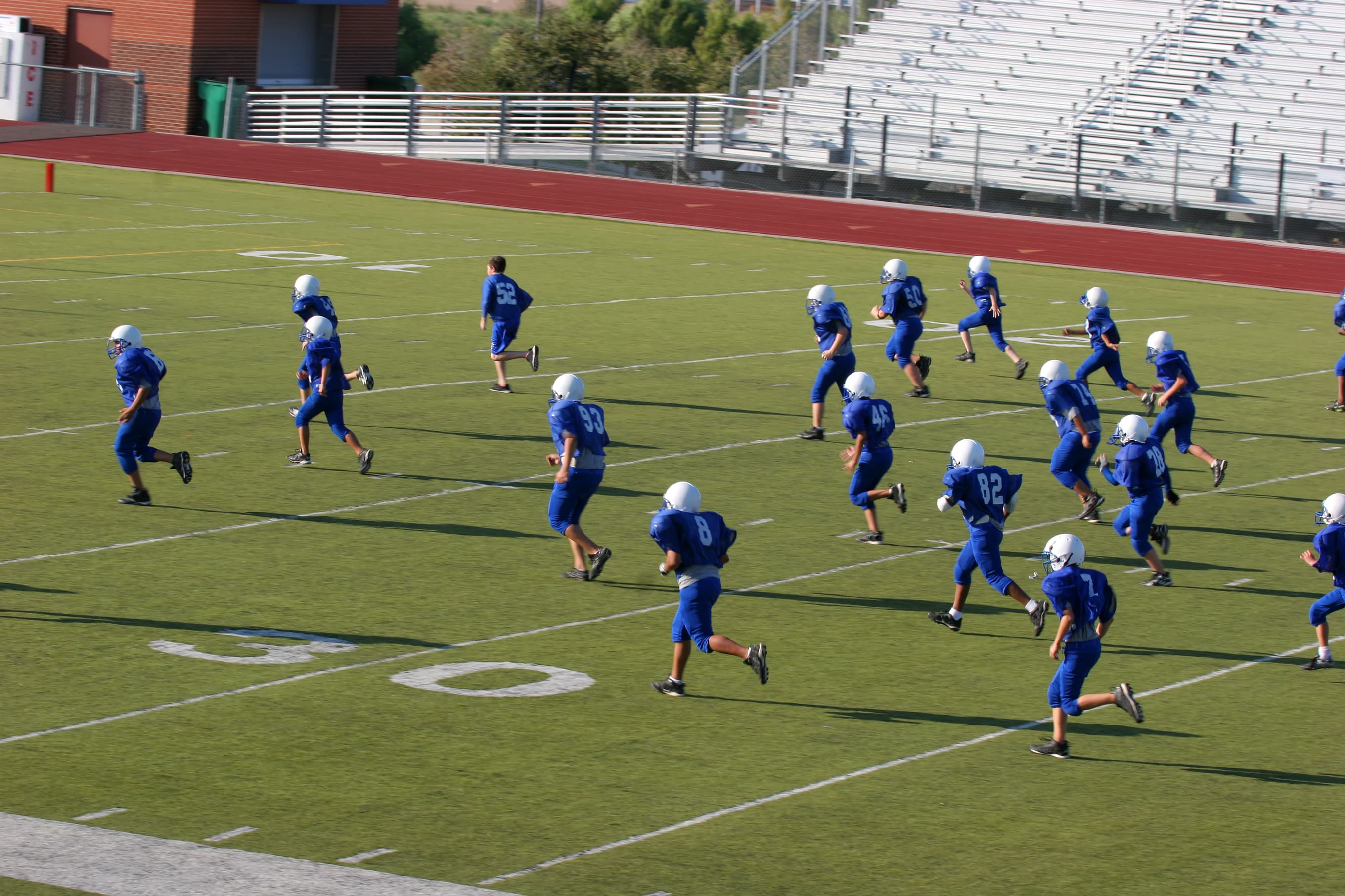 A football team running on to the field.